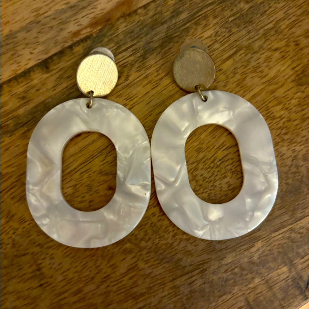 Gold and white earrings